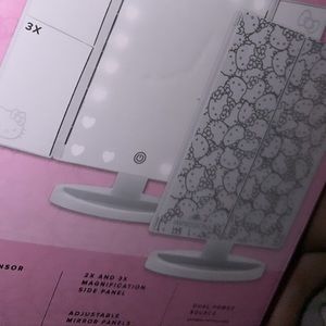 Lights up, trifold, and includes magnifying mirrors!’